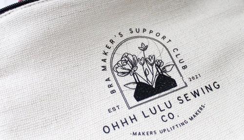 custom printed pouch with business logo to illustrate appeal of making merch for your small business